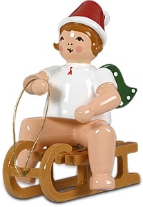 Weihnachtsengel auf Schlitten - sitzend, mit Mütze