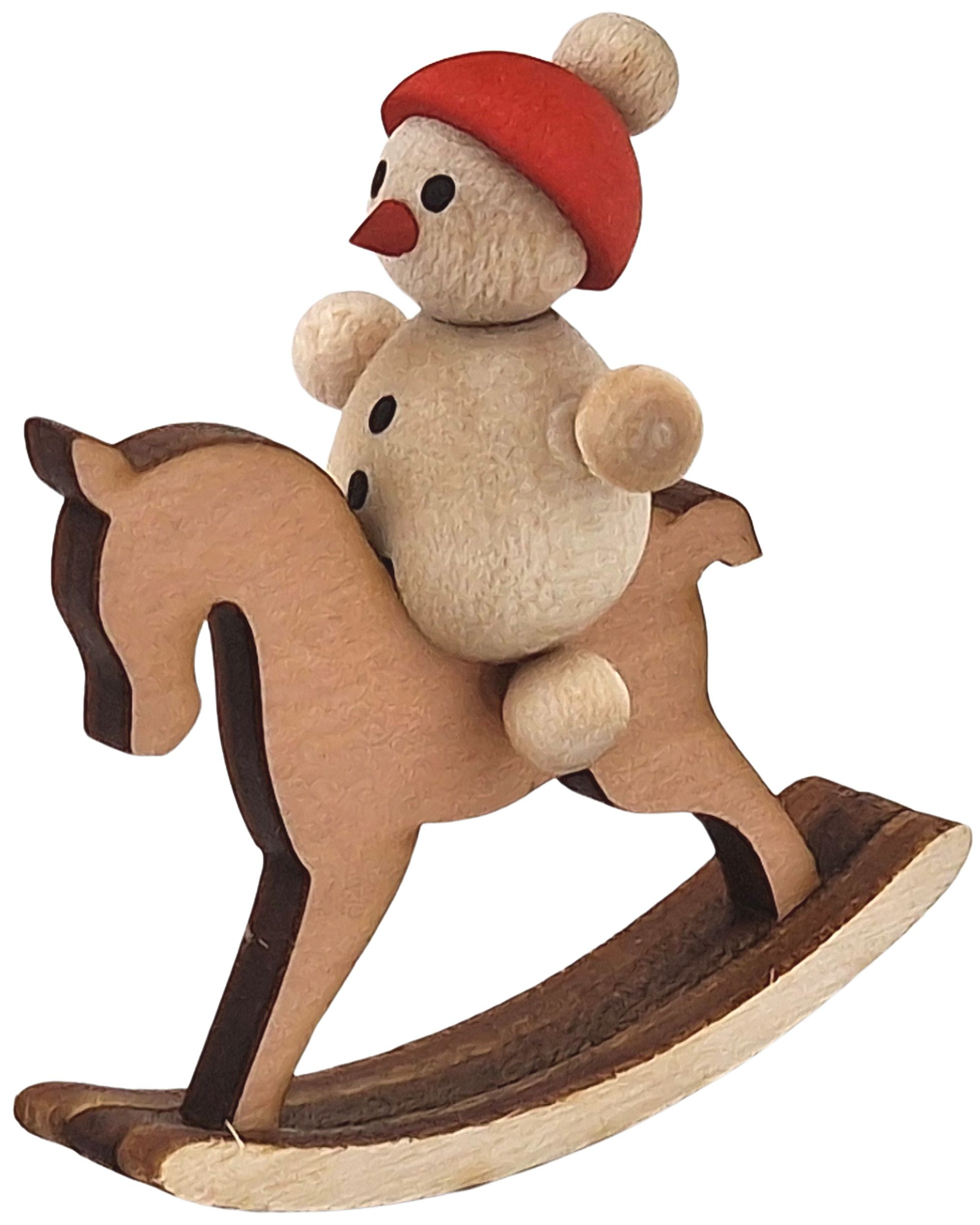 Schneemannkind mit Schaukelpferd