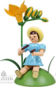 Blumenkind mit Freesie und Klanghölzer, sitzend Blumenkind mit Freesie und Klanghölzer, sitzend