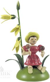 Blumenkind mit Forsythie und Rumbakugel, sitzend, farbig